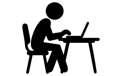 Silhouette of a person typing on a laptop at a desk