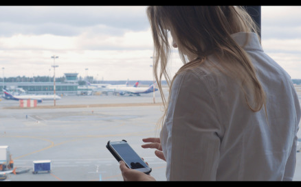 Woman texting and looking at airport - Stock Video