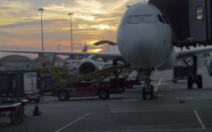 Timelapse of loading airplane at sunset vehicles - Stock Video