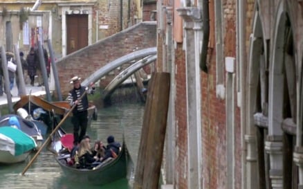 Gondolier Diverting a Gondola Boat with Tourists vehicles - Stock Video
