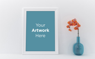 Empty photo frame with flower in vase product mockup