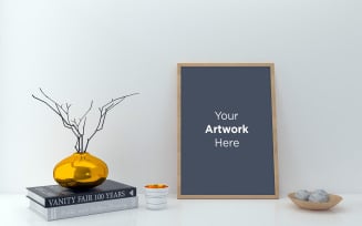 Empty wooden frame mockup with vase and books on the table product mockup