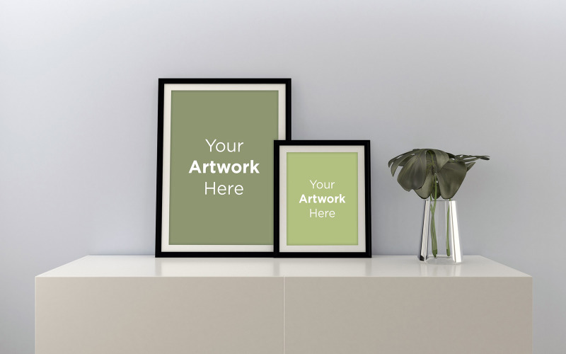Two vertical blank photo frames mockup with plant in glass vase on the cabinet product mockup Product Mockup