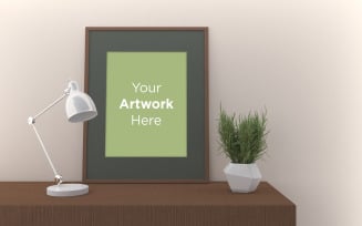 Vertical empty frame mockup with lamp and plant product mockup
