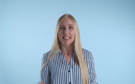 Excited blonde woman yelling and raising fists in cheer - video footage Stock Video