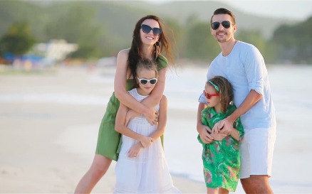 Family of Four Walking on White Beach Video Stock Video