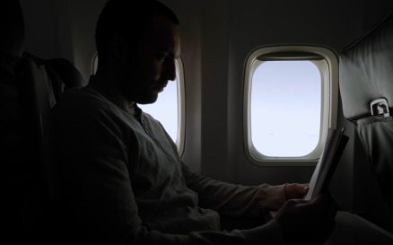 Man Reading Book During Flight Video Stock Video