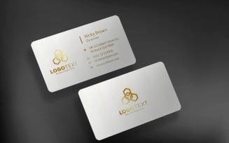 White Business Card Mockup with Golden Text on dark background Product Mockup