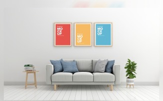 Gray Sofa In A Minimalistic Living Room With Three Frames Mockup On Walls