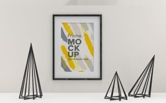 Black frame on a white wall with abstract decor Template mockup