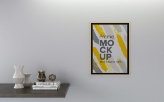 A Closeup Shot Of A Black Frame With Decorative Items On The Shelf
