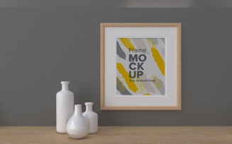 Frame Next To Vases On A Gray Wall Mockup Template