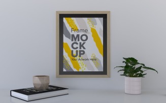Frame With Book And Decor On The Shelf Mockup Template