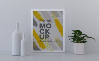 Frame With Vases And Book On The Shelf Mockup Template