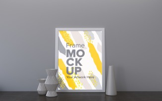 White Frame With Decorative Items On The Table Mockup Template