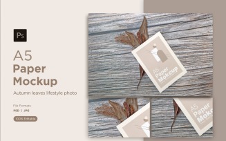 A5 Paper Mockups With Dry Leaves and pinus leaves and mimosa tree seed on Wooden background