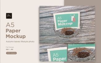 A5 Paper mockup With craftel bowl and Conifer cone on Wooden Background