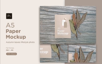 A5 Paper Mockups With Green Leaves and Autumn Themes on Wooden background