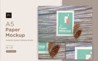 A5 Paper Mockups With Conifer cone and pinus leaves on Wood background