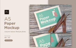 A5 Paper Mockups With mimosa tree seed on Wooden background