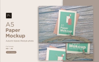 A5 Paper Greeting card Mockups With driftwood on Wooden background