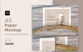 A5 Paper Mockups With autumn themes and driftwood on Wooden background
