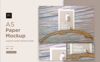 A5 Paper Mockups With driftwood and autumn themes on Wooden background