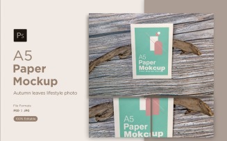 A5 Paper Mockups With driftwood on Wooden background