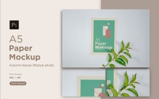 A5 Paper Mockups With orange plant Leaves White Background