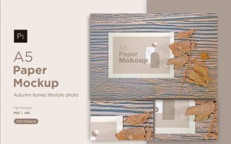 A5 paper Greeting card mockups with Dry leaves on wood background