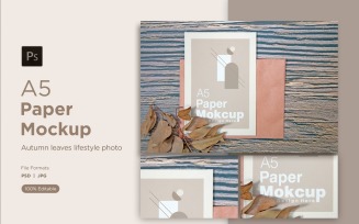A5 paper greeting card mockups with Dry leaves on wooden background