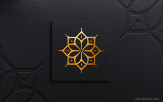 A black square with a gold flower luxury logo mockup design.