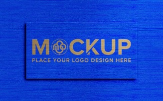 Logo mockup on blue fabric background texture