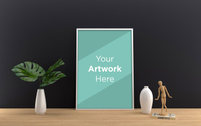 Werkruimtebureau met leeg frame mockup en plant in vaasproductmodel