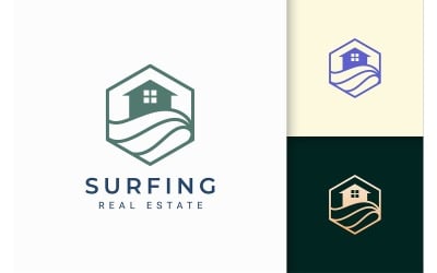 Plantilla de logotipo de bienes raíces de mar o playa