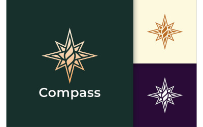 El logotipo de la brújula en estilo moderno y lujoso representa el viaje