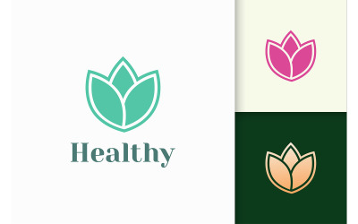 Logo de fleur au féminin et au luxe pour la santé et la beauté