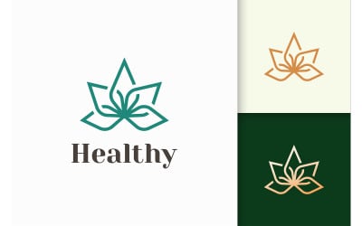 Logotipo de belleza o salud en forma de flor para bienestar o clínica