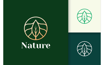 Logotipo de flor de lujo con círculo y hoja