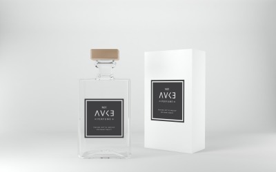 Una bottiglia e una scatola di profumo isolate su sfondo bianco