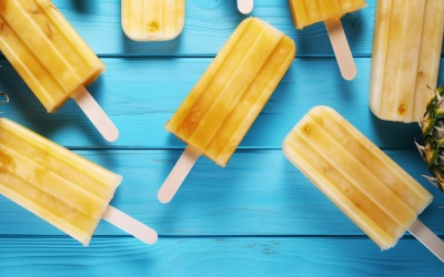 Pineapple on light blue wooden background 006