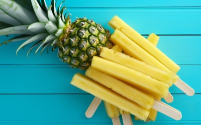 Pineapple on light blue wooden background 008