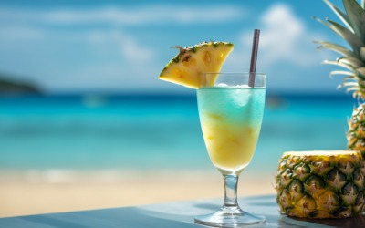 pineapple drink in cocktail glass and sand beach scene 125