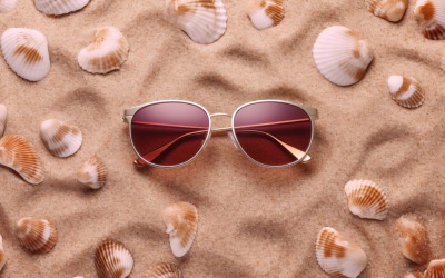 Sunglasses seashells and beach accessories on sandy beach 194