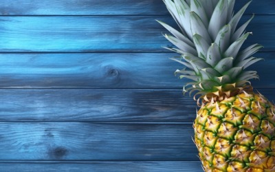 Slice pineapple with sticks on blue wooden background 284