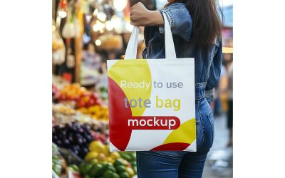 Tote Bag Mockup Held by a Woman in a Busy Street Market.