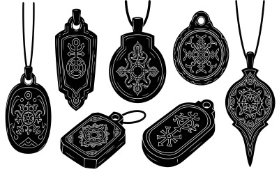 Mystical black pendants and amulets with intricate white symbolic, isolated on white background