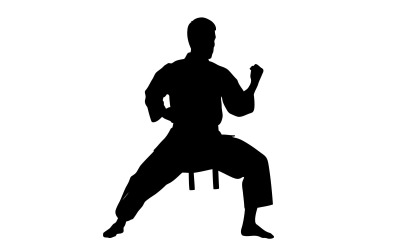 Black silhouette of a karate man in fighting stance isolated on white background