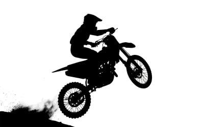 Motocross rider performing an airborne jump on a dirt bike in action isolated on white background