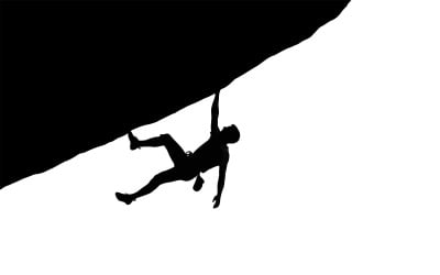 Athletic skateboarder executing mid-air trick in striking silhouette isolated on white background